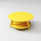 Modern Round Coffee Table in yellow, built to endure outdoor weather